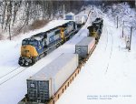 CSX SD70MAC 725, leads westbound Q137 and makes a meet with Q138 on the ex-B&O Keystone sub at, Sand Patch, Pennsylvania. January 25, 2003. 